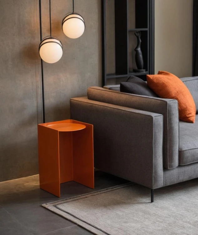 Sofa-linen-fabric-beige-cushions-dark-grey-throw-pillows-dark-brown-wall-BLACK-STEEL-side-table-metal-legs-dark-grey-rug-abstract-orange-sculpture-dark-wooden-shelving-unit-glass-pendant-lamps-metal-lam.jpg
